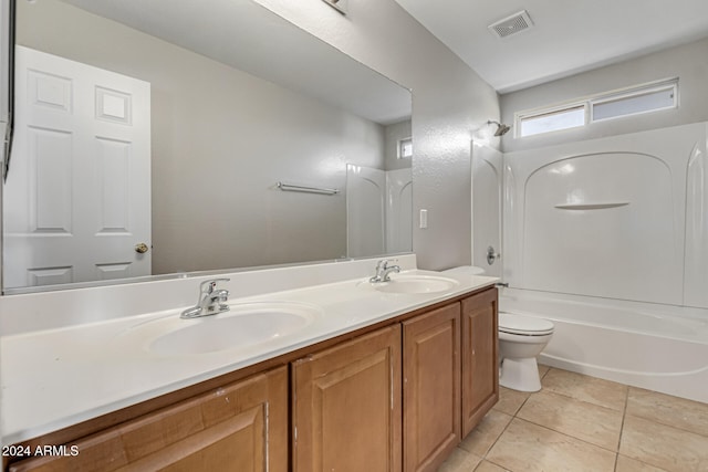 full bathroom with toilet, vanity, washtub / shower combination, and tile patterned flooring