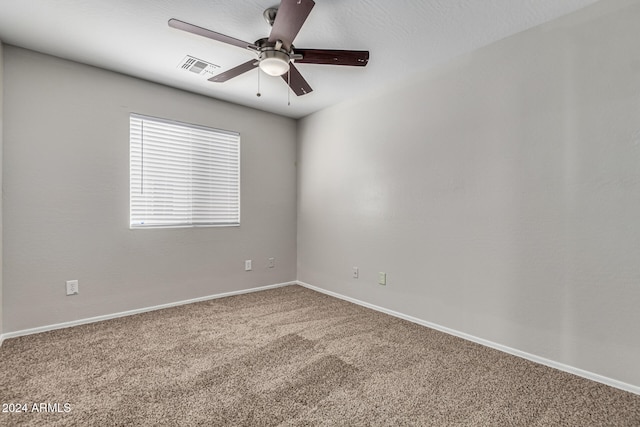 unfurnished room featuring carpet and ceiling fan