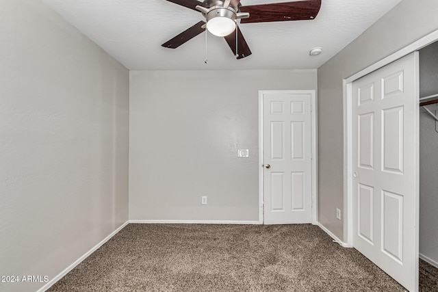 unfurnished bedroom featuring a closet, ceiling fan, and carpet floors