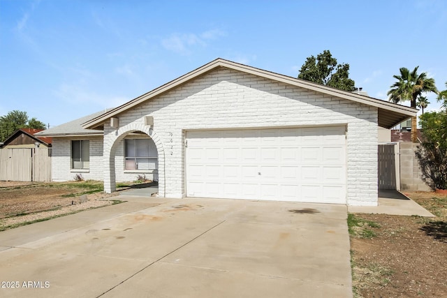 9622 N 35th Ln, Phoenix, AZ 85051 - single story home with driveway, brick siding, and a garage