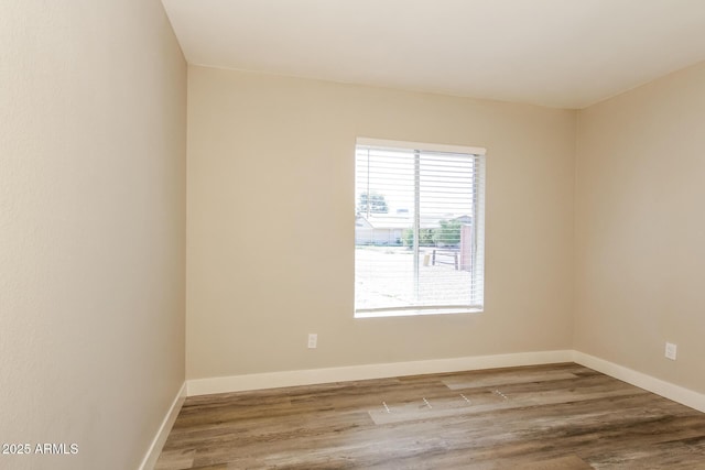 9622 N 35th Ln, Phoenix, AZ 85051 - unfurnished room featuring wood finished floors and baseboards