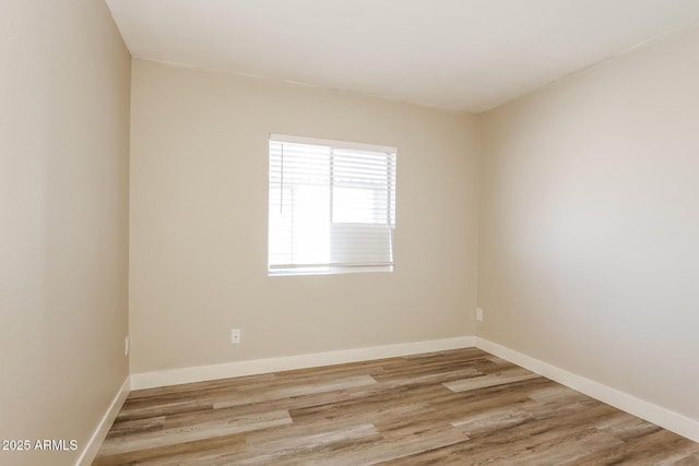 9622 N 35th Ln, Phoenix, AZ 85051 - spare room featuring wood finished floors