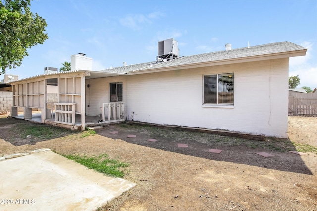 9622 N 35th Ln, Phoenix, AZ 85051 - rear view of property featuring a chimney and a patio area