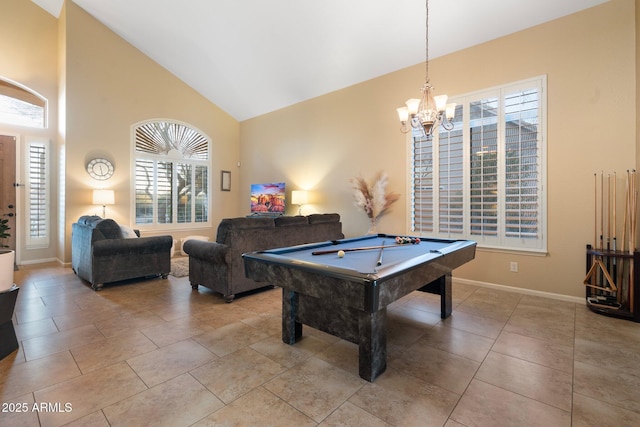 rec room with light tile patterned floors, pool table, high vaulted ceiling, and a chandelier