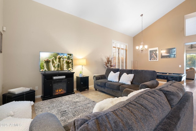 tiled living room featuring an inviting chandelier, pool table, and high vaulted ceiling