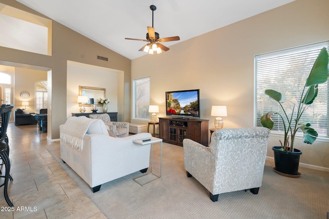 living room featuring high vaulted ceiling, light tile patterned floors, and ceiling fan