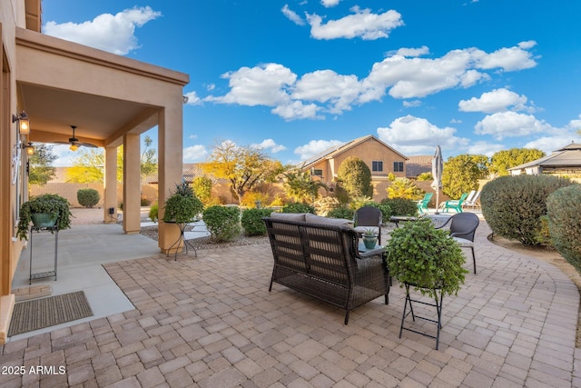 view of patio / terrace with an outdoor living space and ceiling fan