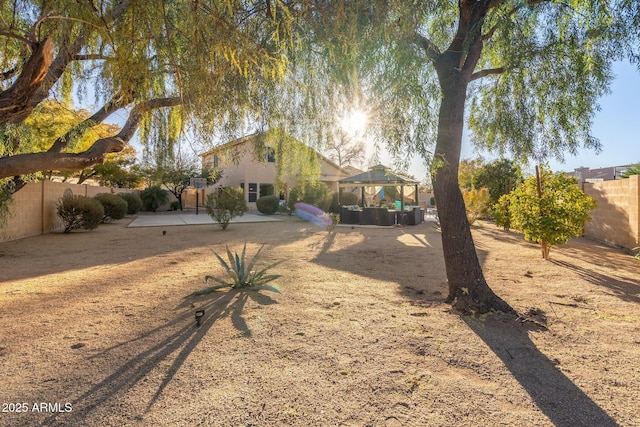 view of yard featuring a gazebo and a patio