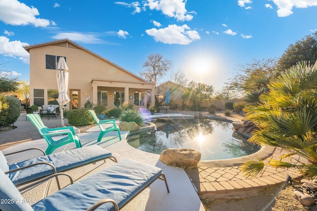 view of swimming pool featuring a patio area