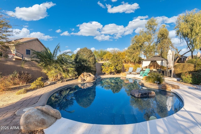 view of pool featuring a gazebo and a patio