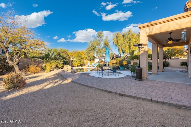 view of patio / terrace featuring ceiling fan