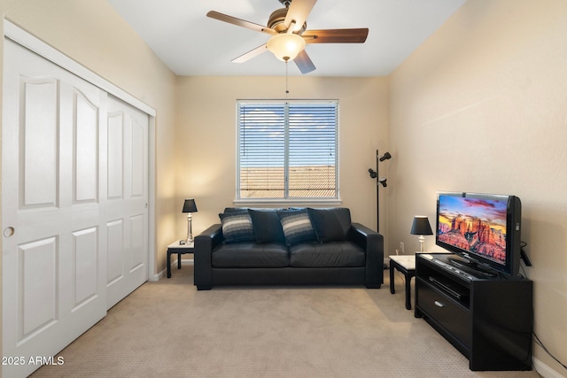 living room featuring light colored carpet and ceiling fan