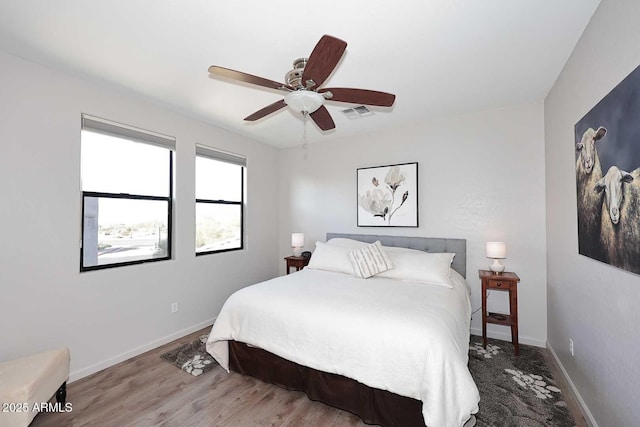 bedroom featuring hardwood / wood-style floors and ceiling fan