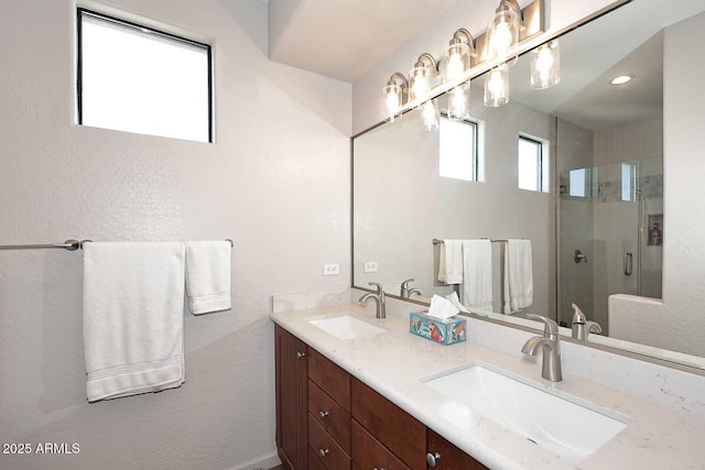 bathroom featuring vanity and an enclosed shower