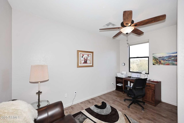 office area with light wood-type flooring and ceiling fan