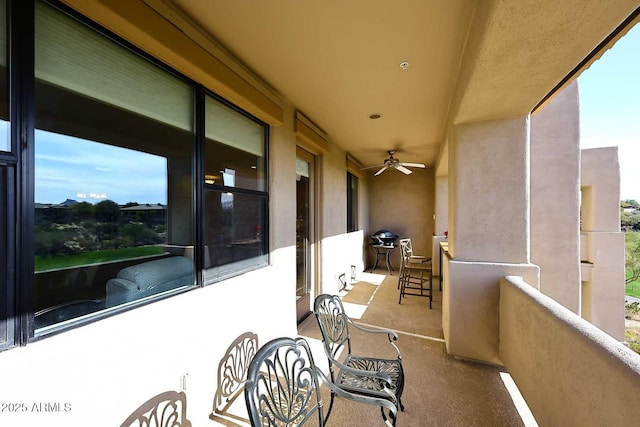 balcony featuring ceiling fan