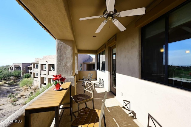 balcony featuring ceiling fan