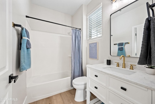 bathroom with shower / bath combo, vanity, toilet, and wood finished floors