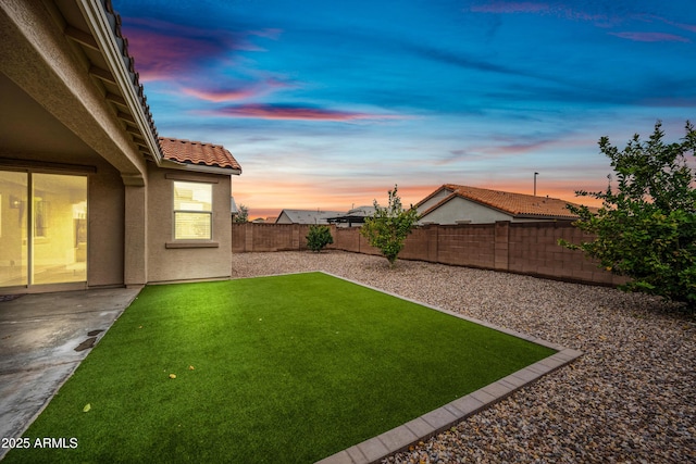 view of yard with a patio area and a fenced backyard