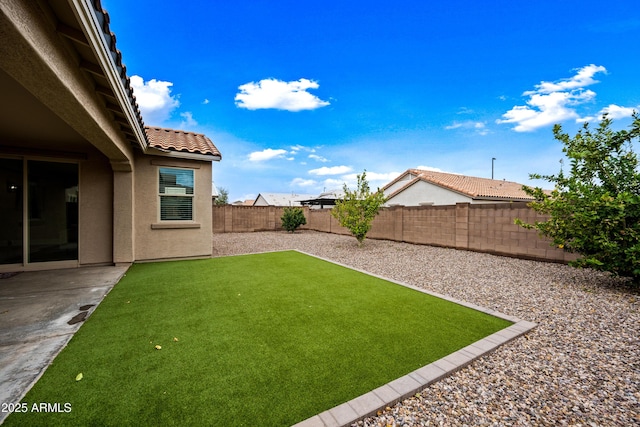 view of yard featuring a patio and a fenced backyard