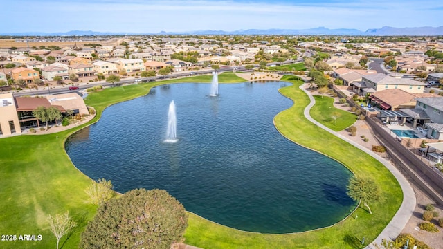 drone / aerial view featuring a water view and a residential view