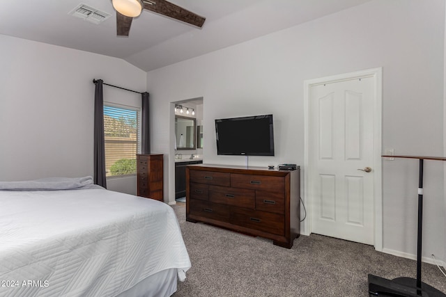 carpeted bedroom featuring lofted ceiling, ceiling fan, and ensuite bathroom