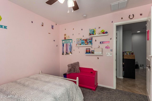 carpeted bedroom with ceiling fan