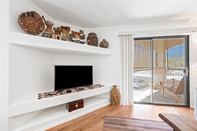 living area with wood finished floors