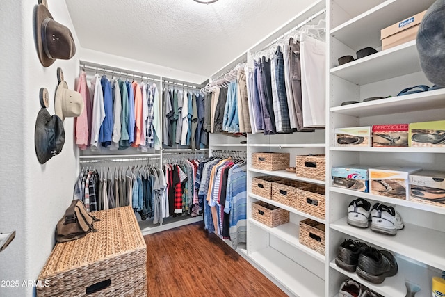 spacious closet with wood finished floors