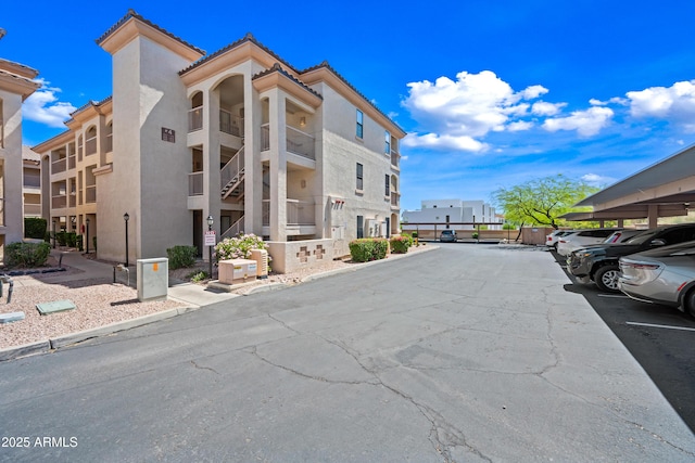 view of property featuring covered parking
