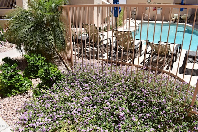 pool with fence and a patio area