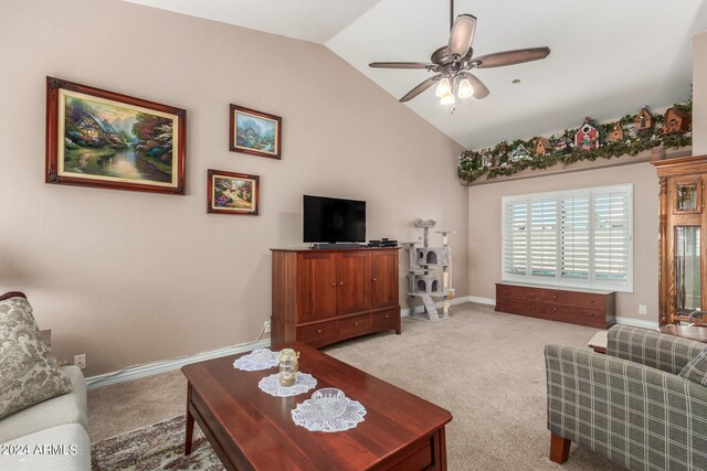 living room featuring lofted ceiling, light colored carpet, and ceiling fan