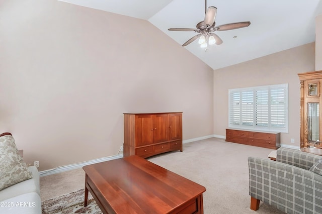 living area with ceiling fan, light carpet, baseboards, and high vaulted ceiling