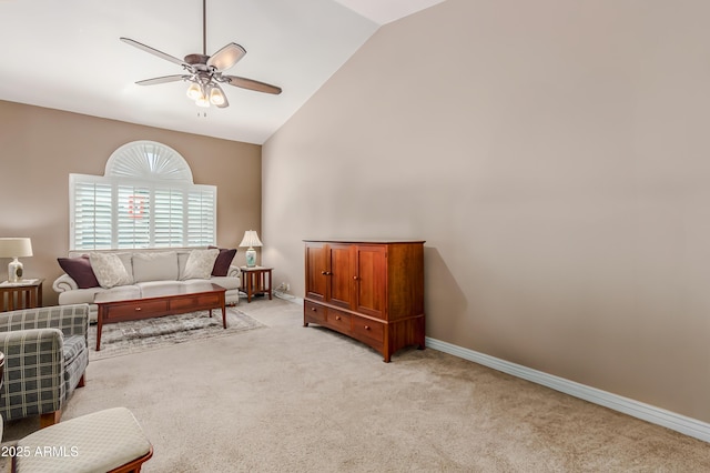 living room with light colored carpet, baseboards, ceiling fan, and high vaulted ceiling