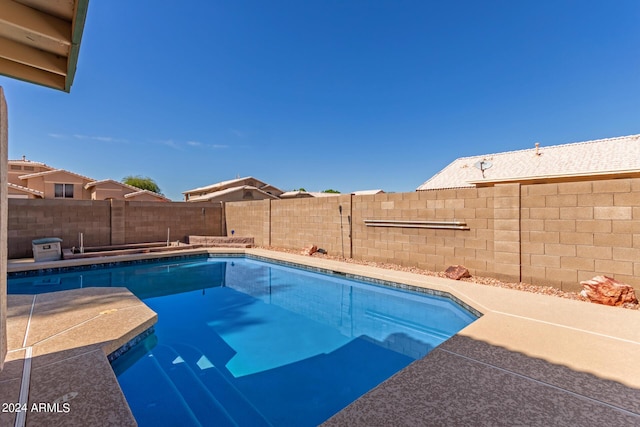 view of pool with a patio, a fenced in pool, and a fenced backyard