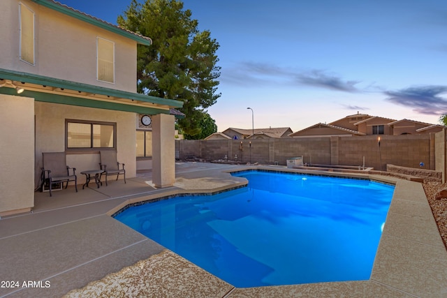 view of pool with a fenced backyard, a fenced in pool, and a patio area