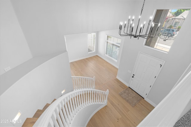 641 W Oriole Way, Chandler, AZ 85286 - foyer entrance with plenty of natural light, a chandelier, wood finished floors, and a towering ceiling