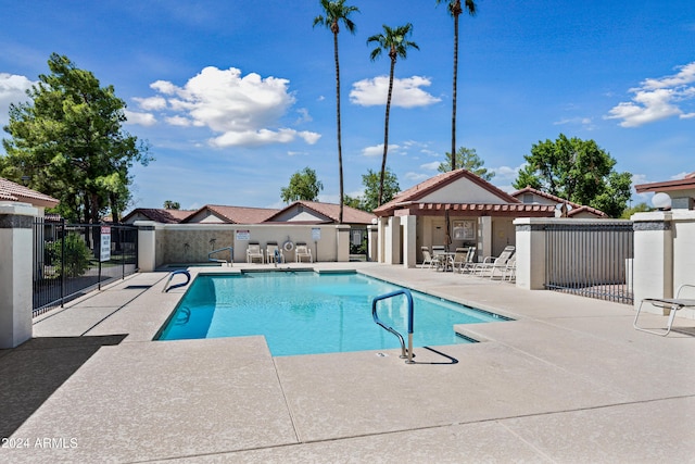 view of swimming pool featuring a patio