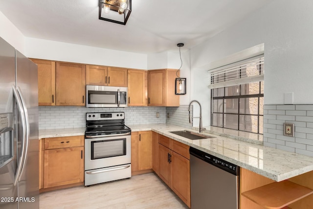 4901 E Kelton Ln Unit 1251, Scottsdale, AZ 85254 - kitchen featuring stainless steel appliances, tasteful backsplash, open shelves, light stone counters, and light wood-style floors