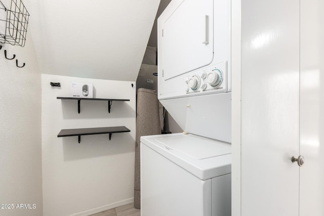 4901 E Kelton Ln Unit 1251, Scottsdale, AZ 85254 - laundry room featuring estacked washer and dryer and baseboards