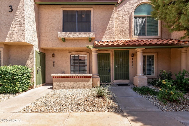 4901 E Kelton Ln Unit 1251, Scottsdale, AZ 85254 - view of front of home with stucco siding and a tile roof