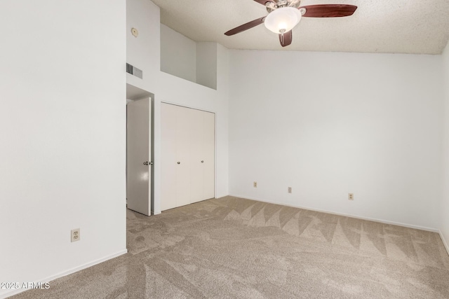 4901 E Kelton Ln Unit 1251, Scottsdale, AZ 85254 - unfurnished bedroom featuring carpet, high vaulted ceiling, and a ceiling fan