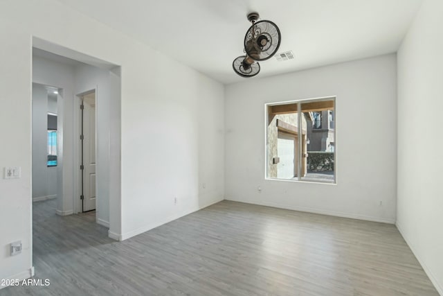 unfurnished room with light hardwood / wood-style flooring