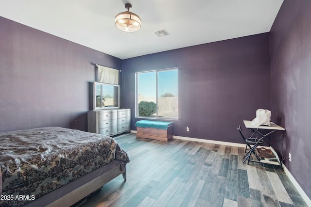 bedroom with wood-type flooring