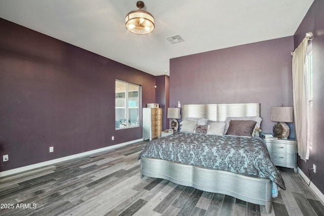 bedroom with hardwood / wood-style floors