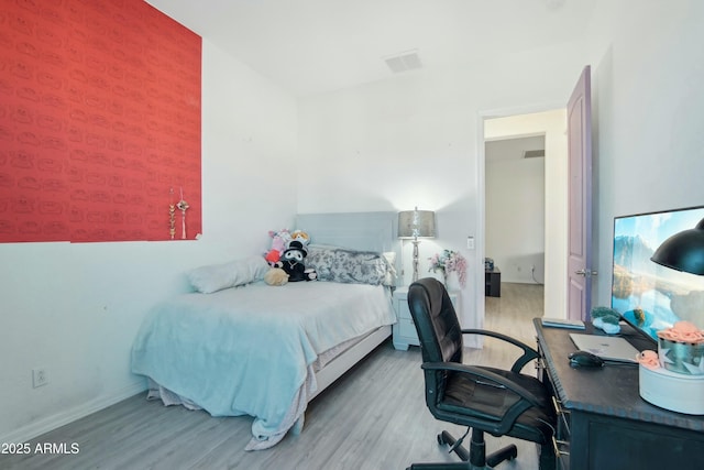 bedroom featuring light hardwood / wood-style flooring