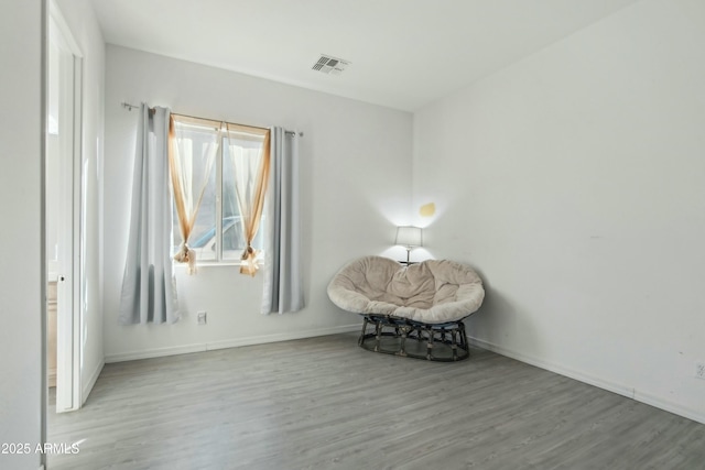 sitting room featuring light hardwood / wood-style floors