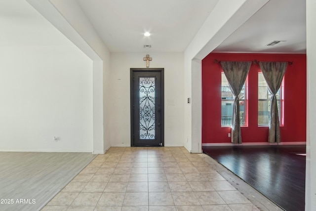 entryway with light hardwood / wood-style floors