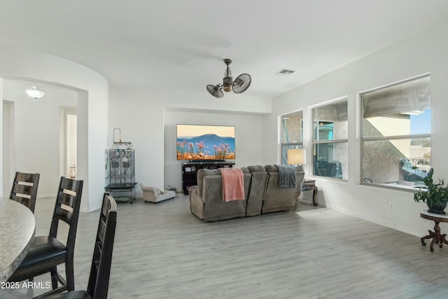 living room with a chandelier and light hardwood / wood-style floors