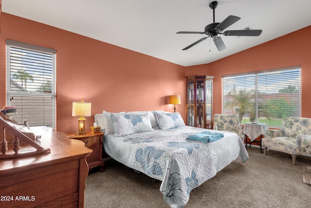 carpeted bedroom featuring ceiling fan and lofted ceiling